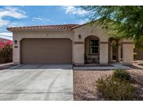 One-story home with a two-car garage and inviting front porch at 19919 W Lincoln St, Buckeye, AZ 85326