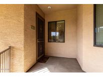 Condo entry with security door, window, and tiled flooring at 3330 S Gilbert Rd # 2001, Chandler, AZ 85286