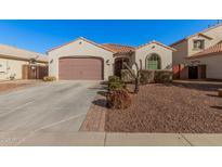 One-story house with a two-car garage and well-maintained landscaping at 3667 S 185Th Dr, Goodyear, AZ 85338