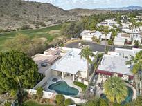 Aerial view of a home with a pool, showcasing the property's location and landscaping at 4605 E Valley View Dr, Phoenix, AZ 85044