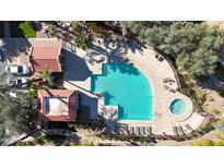 Community pool and spa with surrounding lounge chairs and landscaping at 5122 E Shea Blvd # 1100, Scottsdale, AZ 85254