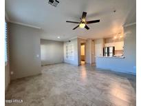 Spacious living room with tile floors and ceiling fan at 5401 E Van Buren St # 2083, Phoenix, AZ 85008