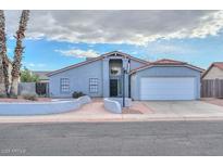 Single-story home with attached garage and landscaped front yard at 6339 W Ironwood W Dr, Glendale, AZ 85302