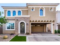 Two-story home with brick accents and a two-car garage at 653 N Abalone Dr, Gilbert, AZ 85233