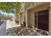 Inviting condo entryway with well-manicured landscaping and a welcoming doormat at 832 W 14Th St, Tempe, AZ 85281