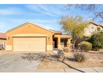 Single-story house with attached garage and desert landscaping at 11386 W Buchanan St, Avondale, AZ 85323