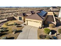 Single-story home with solar panels and desert landscaping at 1306 E Cecil Ct, Casa Grande, AZ 85122