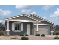 One-story home with gray siding, stone accents, and a two-car garage at 22827 E Lords Way, Queen Creek, AZ 85142