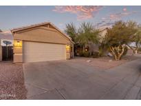 Tan house with two-car garage and desert landscaping at 4322 E South Fork Dr, Phoenix, AZ 85044