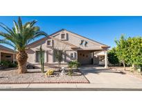 Single-story home with desert landscaping and a two-car garage at 6562 S Sawgrass Dr, Chandler, AZ 85249