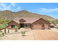 Stunning desert home with a three-car garage and mountain views at 8474 W Switchback Trl, Casa Grande, AZ 85194