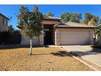 One-story house with a two-car garage and a front yard at 1244 S Portland Ave, Gilbert, AZ 85296