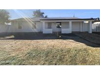 Newly renovated single-story home with a spacious front yard at 130 N 95Th Pl, Mesa, AZ 85207