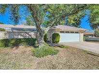 Single-story home with attached garage and mature landscaping at 18852 N Aztec Dr, Sun City, AZ 85373