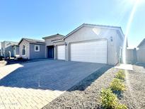 Single-story home with a two-car garage and desert landscaping at 22665 E Stacey Rd, Queen Creek, AZ 85142