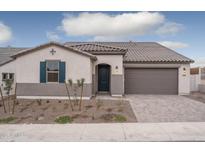 Single-story home with gray exterior, tile roof, and a 2-car garage at 2732 N 217Th Ave, Buckeye, AZ 85396