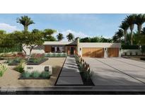 Modern house with landscaped front yard and two-car garage at 3801 N 64Th St, Scottsdale, AZ 85251