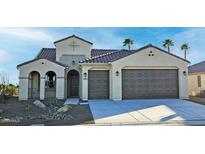 Single-story home with two-car garage and desert landscaping at 5411 W Windmill Ln, Eloy, AZ 85131