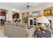 Spacious living room with fireplace and built-in entertainment center at 28429 N 101St Pl, Scottsdale, AZ 85262