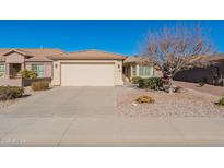Single-story home with a two-car garage and desert landscaping at 3056 E Palm Beach Dr, Chandler, AZ 85249