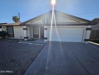 Ranch style home with a two-car garage and well-maintained landscaping at 4509 E La Puente Ave, Phoenix, AZ 85044