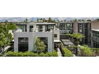 Modern architectural home with a clean design and lush landscaping at 6933 E 1St St # B, Scottsdale, AZ 85251