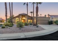 Attractive single-story home with desert landscaping, and a two-car garage at 10484 E Mission Ln, Scottsdale, AZ 85258