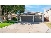 Two-car garage and well-maintained front yard at 1274 N Ithica St, Gilbert, AZ 85233