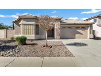 Single-story home with a two-car garage and desert landscaping at 1803 N Desert Willow St, Casa Grande, AZ 85122