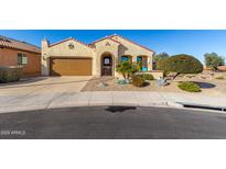 Single-story home with desert landscaping and a two-car garage at 21268 N 266Th Ln, Buckeye, AZ 85396