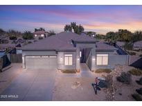 Single-story home with a neutral color palette and a two-car garage at 43102 W Venture Rd, Maricopa, AZ 85138