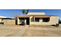 Tan stucco exterior, tile roof, and small front yard at 4730 W Rose Ln, Glendale, AZ 85301