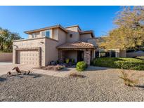 Two-story house with stone accents and a landscaped front yard at 5432 E Grandview Rd, Scottsdale, AZ 85254