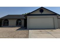 Updated single story home with new paint and landscaping at 7045 W Ocotillo Rd, Glendale, AZ 85303