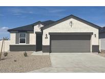 Charming single-story home featuring a two-car garage and low maintenance front yard at 109 S Collier Ln, Casa Grande, AZ 85122