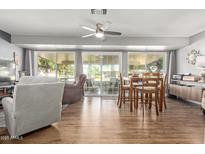 Bright dining area with wood table and access to a patio at 13635 N Emberwood Dr, Sun City, AZ 85351