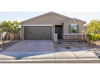 Single-story home with two-car garage and desert landscaping at 19959 W Rancho Dr, Litchfield Park, AZ 85340