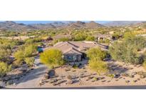 Single-story home with a large backyard, pool, and mountain views at 5650 E Villa Cassandra Way, Carefree, AZ 85377