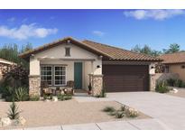 One-story home with a brown garage door and a teal front door at 7652 W Minton St, Laveen, AZ 85339