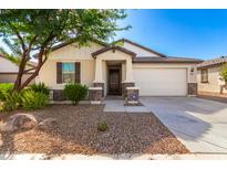 One-story house with front yard landscaping and a two-car garage at 8209 W Lane Ave, Glendale, AZ 85303