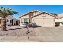 Cute one-story home with a two-car garage and desert landscaping at 10642 W Mohawk Ln, Peoria, AZ 85382