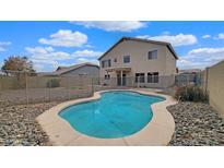 Relaxing backyard oasis with a kidney-shaped pool at 12618 W Catalina Dr, Avondale, AZ 85392