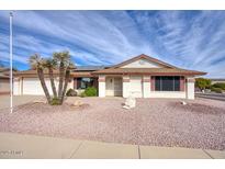 Single-story home with desert landscaping and a two-car garage at 14702 W Buttonwood Dr, Sun City West, AZ 85375