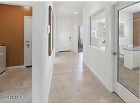 Bright hallway with tile flooring and access to other rooms at 1649 N Fenway Dr, Florence, AZ 85132