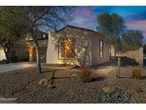 Single-story home with desert landscaping and two-car garage at 29798 N 121St Dr, Peoria, AZ 85383