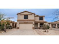 Two-story house with a beige exterior, attached garage, and landscaping at 30788 N Whirlaway Trl, San Tan Valley, AZ 85143