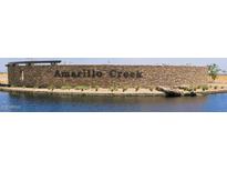 Amarillo Creek community entrance with stonework and water feature at 47748 W Kenner Dr, Maricopa, AZ 85139