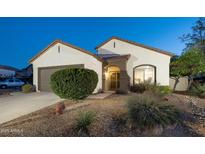 Charming single-story home boasting a well-maintained landscape and attached two car garage in a nice community at 6137 E Roland St, Mesa, AZ 85215