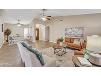 Spacious living room with hardwood floors and a comfortable seating area at 710 S Monterey St, Gilbert, AZ 85233