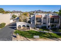 Community entrance with landscaped grounds and mountain views at 8225 N Central Ave # 46, Phoenix, AZ 85020